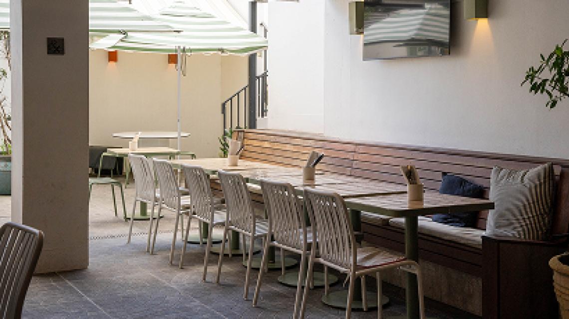 The beer garden terrace with striped umbrellas