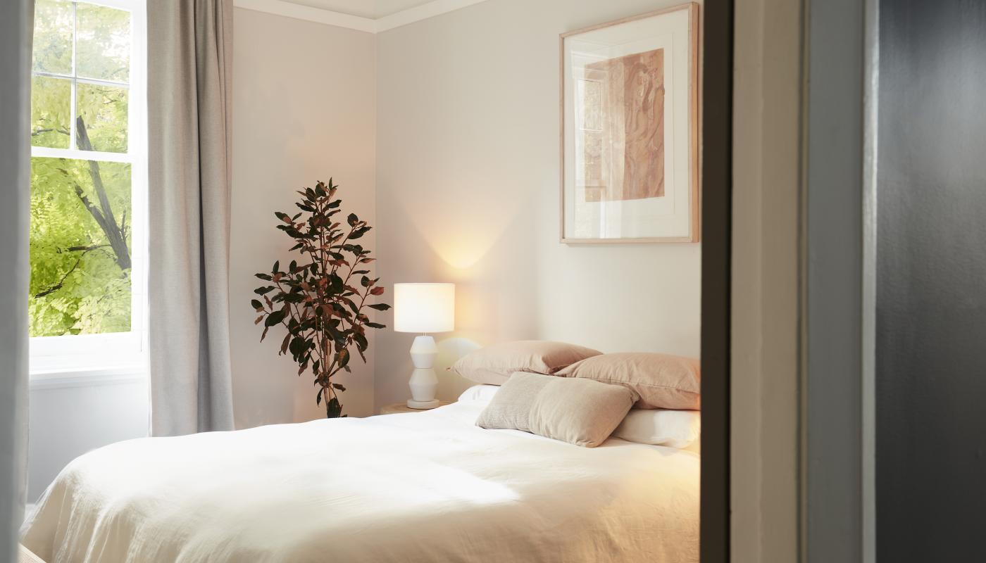 Bedroom glimpsed through the doorway