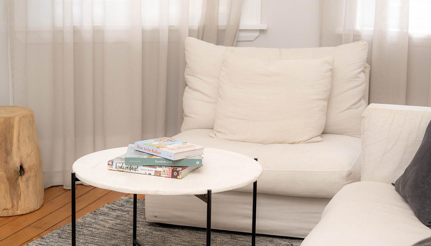 Reading corner with linen sofa and marble table